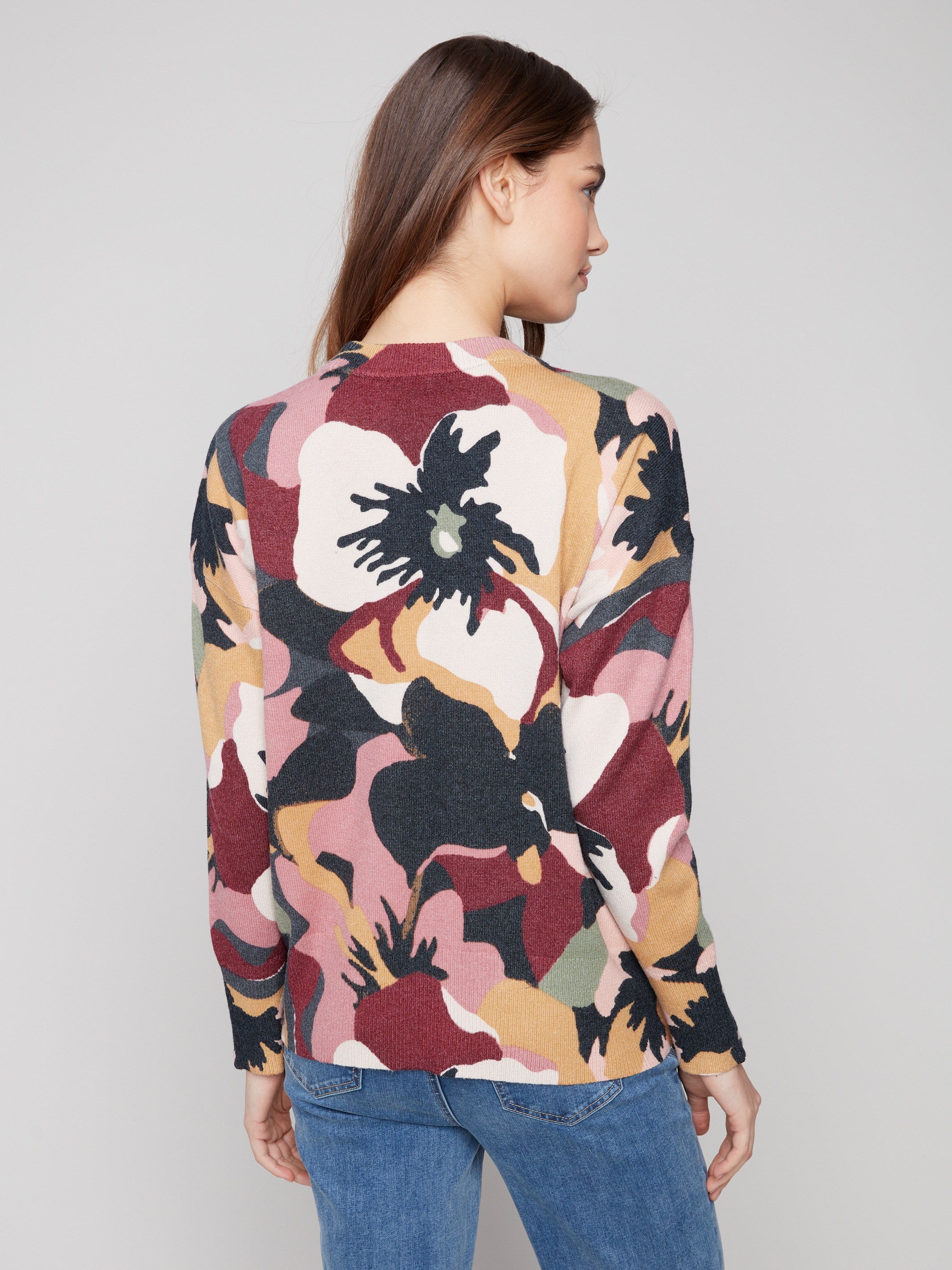 Dolman sleeves enhance the comfort and style of this abstract patterned sweater by Charlie B.