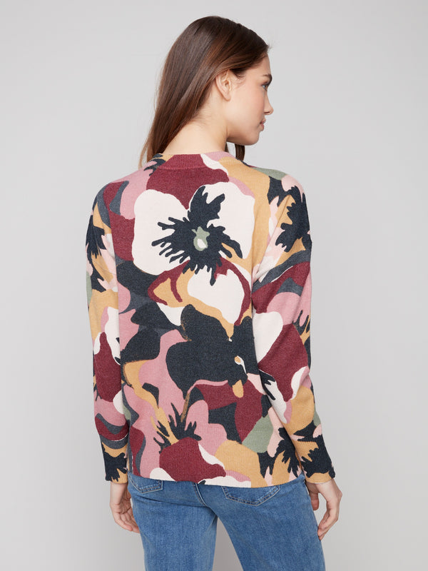Dolman sleeves enhance the comfort and style of this abstract patterned sweater by Charlie B.