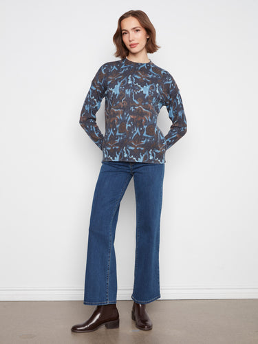 A beautifully patterned sweater paired effortlessly with jeans, perfect for casual outings by Charlie B.