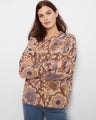 Beige sweater with brown and blue floral print featuring a crew neckline by Charlie B.