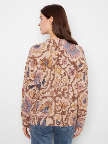 Brown and blue floral sweater crafted with zippered cuffs for added detail by Charlie B.