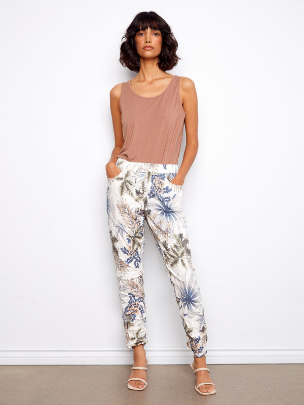 Women's jogger pants with a vibrant floral print, featuring slim fit design and comfortable stretch fabric by Charlie B.