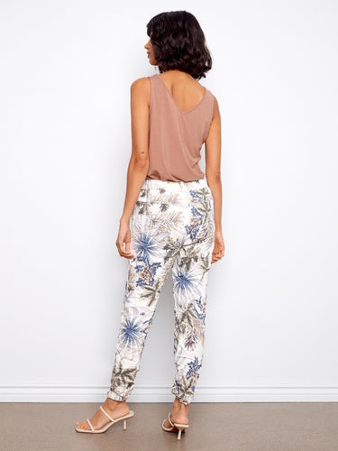 Women's ankle-length joggers with a chic floral pattern in blue tones, designed with two convenient side pockets by Charlie B.
