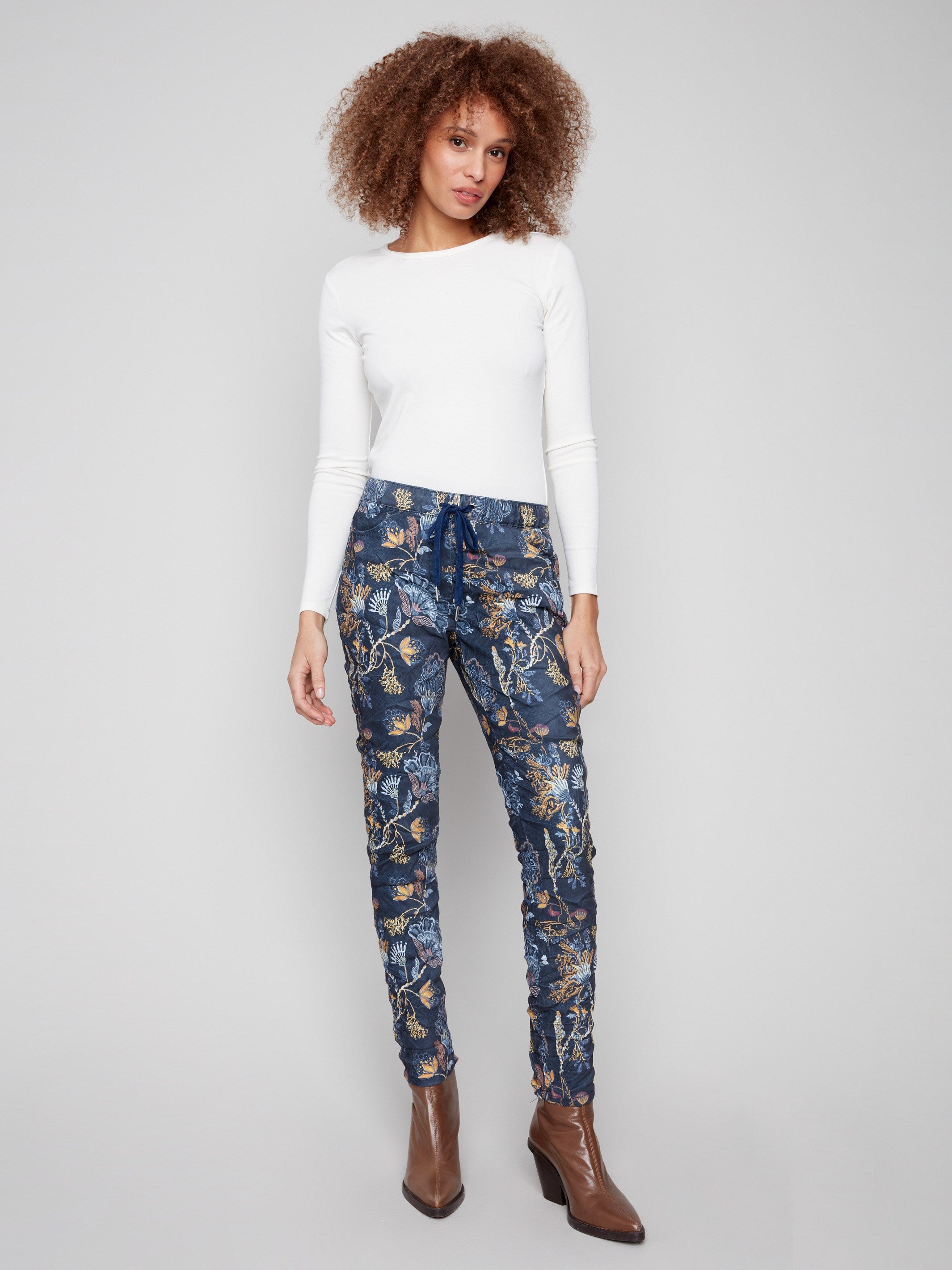 Bohemian print jogger pants with side pockets and a relaxed fit, featuring an elastic waistband for comfort by Charlie B.