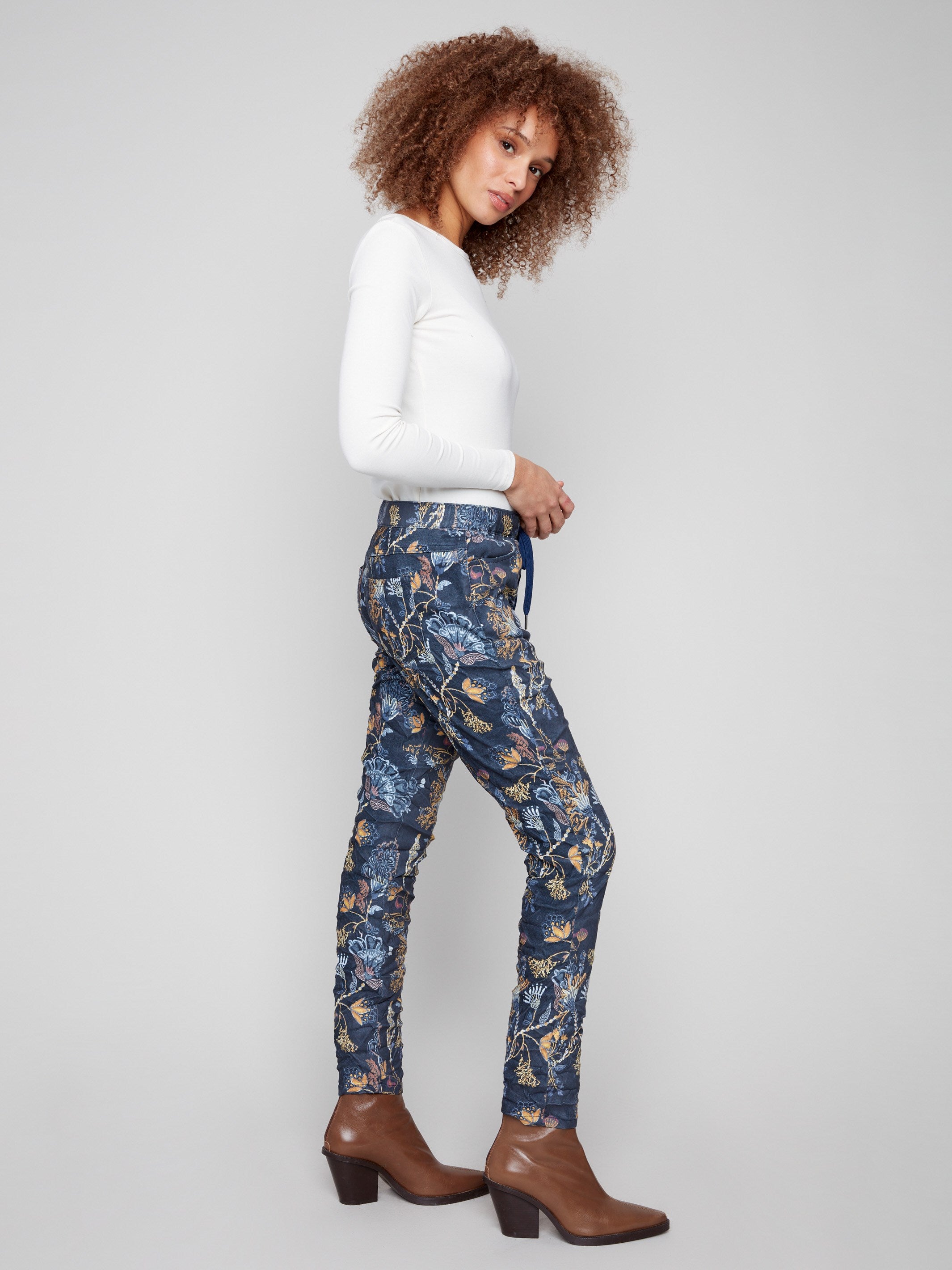 Long length bohemian print joggers with a stylish regular rise and side pockets for added convenience by Charlie B.