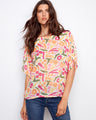 Colorful abstract print blouse with relaxed fit and elbow-length dolman sleeves, made from a lightweight cotton blend by Charlie B.