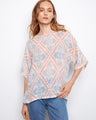 This top features a crew neckline, offering a classic and versatile style. Made by Charlie B.