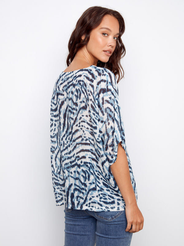 The unique pattern of this top adds visual interest while maintaining a casual elegance perfect for any outing by Charlie B.