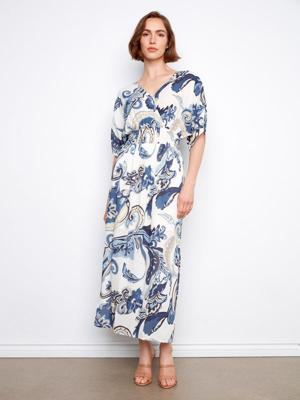 Maxi dress with a V-neck and intricate pattern, featuring a faux wrap design for elegance by Charlie B.