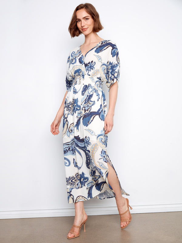 This maxi dress features an exquisite faux wrap design, enhancing its sophisticated look by Charlie B.