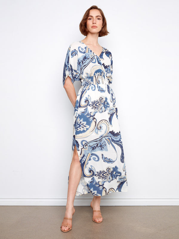 A flowing maxi length adds grace to this stunningly patterned dress with dolman sleeves by Charlie B.