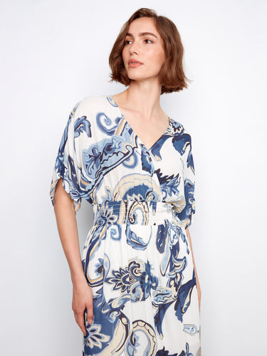 V-neckline and vibrant print make this smocked waist maxi dress a standout piece by Charlie B.