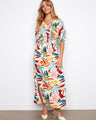 Floral dress featuring a V-neckline and vibrant colors, perfect for any occasion. Designed with elegance and style by Charlie B.