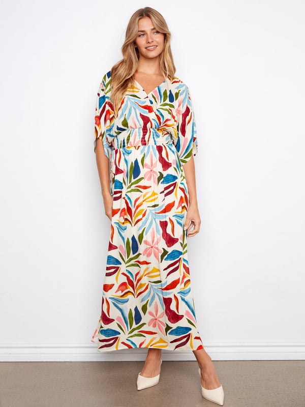 This colorful faux wrap dress offers a flattering fit with its unique design. A chic choice for your wardrobe by Charlie B.