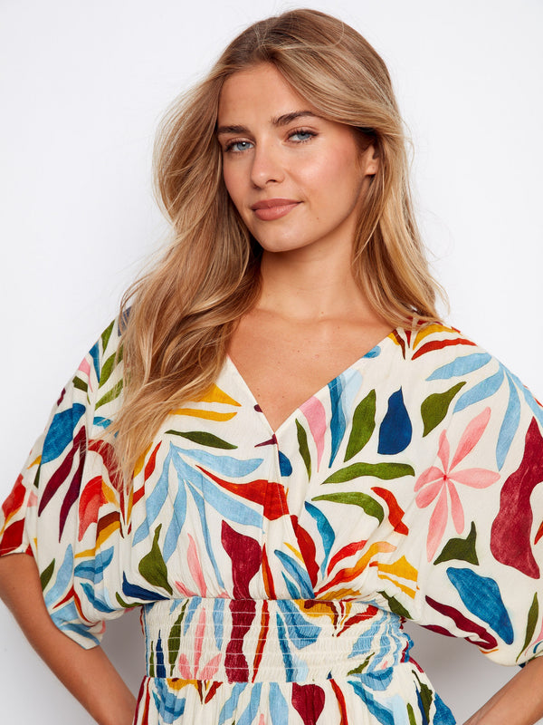 Short dolman sleeves provide an airy feel to this vibrant print dress, blending comfort with fashion effortlessly by Charlie B.