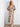 A colorful V-neck maxi dress featuring exquisite detailing and a playful pattern that stands out. Designed thoughtfully by Charlie B.