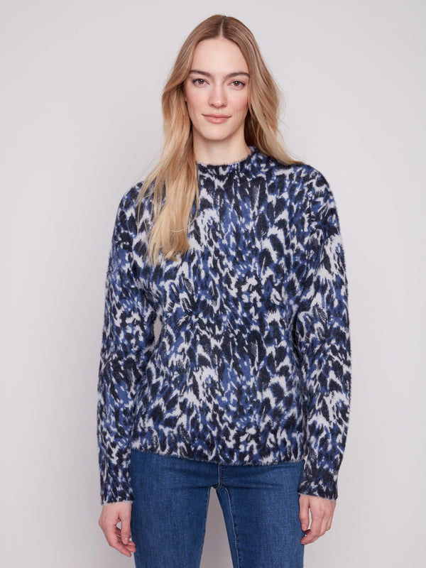 Eyelash fabric sweater with a striking abstract panther pattern, offering both style and warmth by Charlie B.