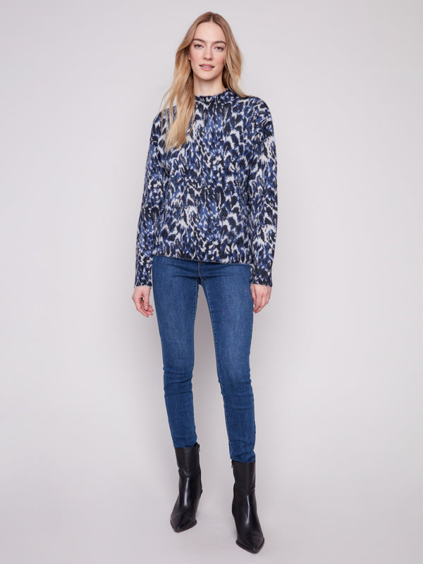 Relaxed fit sweater featuring a unique panther print, blending comfort with modern fashion by Charlie B.