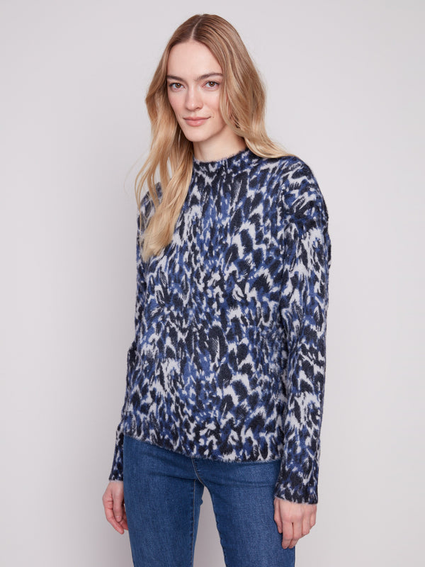 Mock neck design adds elegance to this abstract panther print sweater, perfect for any casual outing by Charlie B.