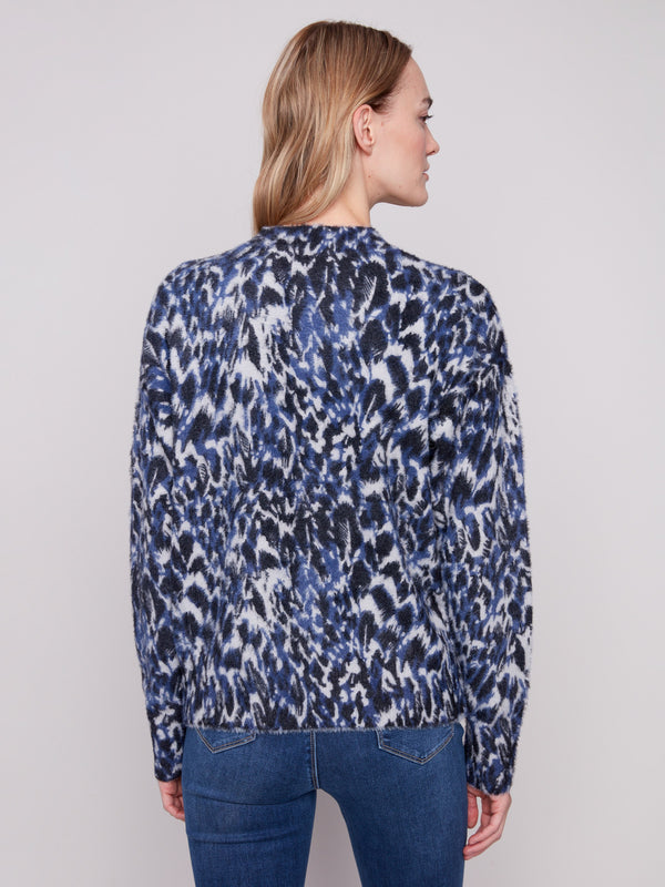Cozy eyelash fabric enhances the texture of this stylish panther pattern sweater for ultimate comfort by Charlie B.