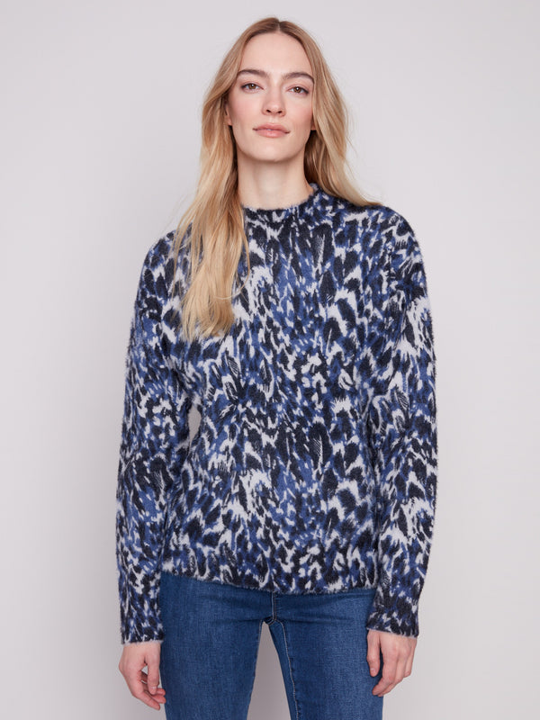 Relaxed fit and mock neck combine in this chic abstract patterned sweater for an effortlessly trendy look by Charlie B.