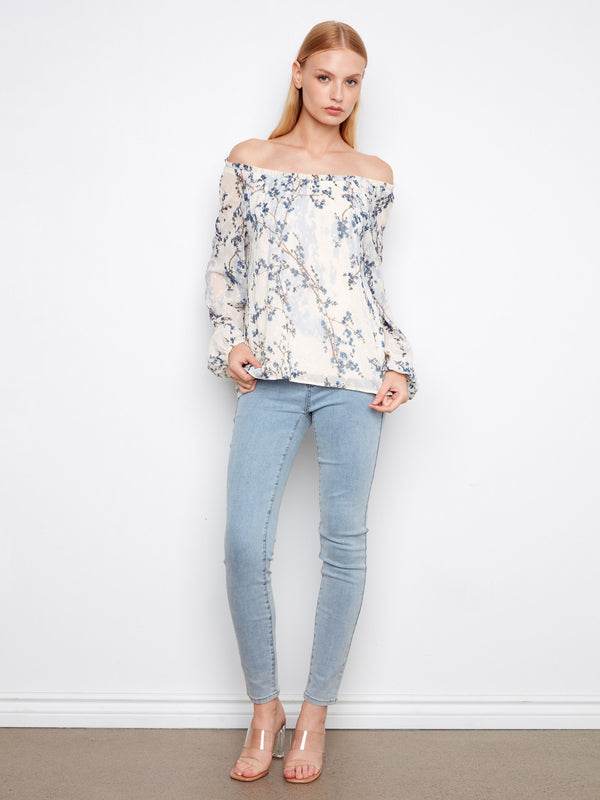 Elegant blouse featuring a printed eyelet design that adds texture and charm to the overall appearance by Charlie B.