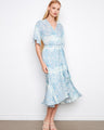 Light blue dress with a V-neck and flutter elbow sleeves, featuring a self-tie belt for added style by Charlie B.