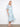 Light blue dress with a V-neck and flutter elbow sleeves, featuring a self-tie belt for added style by Charlie B.