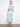 Chic faux wrap dress in light blue with a self-tie belt, showcasing an elegant Maeva pattern by Charlie B.