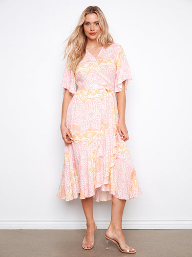 Stylish faux wrap maxi dress in a vibrant print, perfect to make an impression at any gathering by Charlie B.