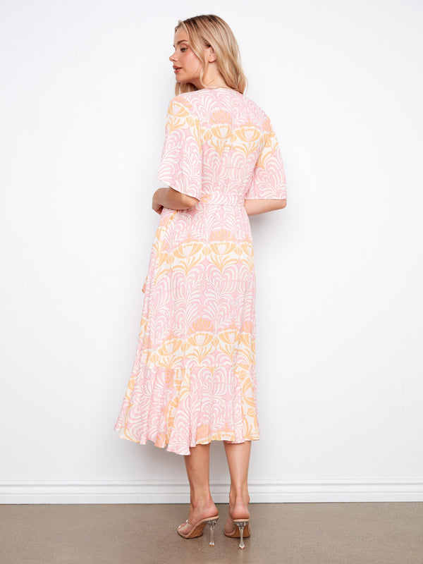 Flowy floral pattern dress with elbow sleeves that adds elegance to your wardrobe. A must-have piece by Charlie B.