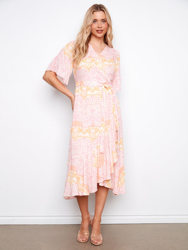 Maxi length floral dress with a V-neck design that adds sophistication to everyday wear. Crafted beautifully by Charlie B.