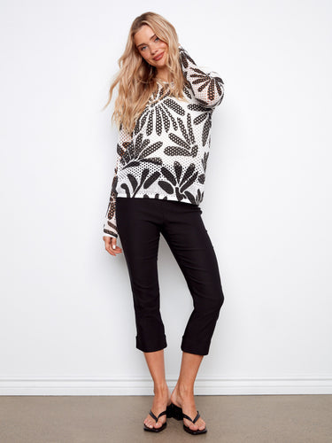Daisy pattern fishnet crochet sweater featuring a cozy hoodie by Charlie B.