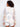 Featuring a practical hoodie, this crochet top blends comfort and fashion effortlessly by Charlie B.