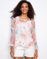 This floral mesh top features a loose fit, creating a relaxed and breezy look perfect for any casual outing by Charlie B.