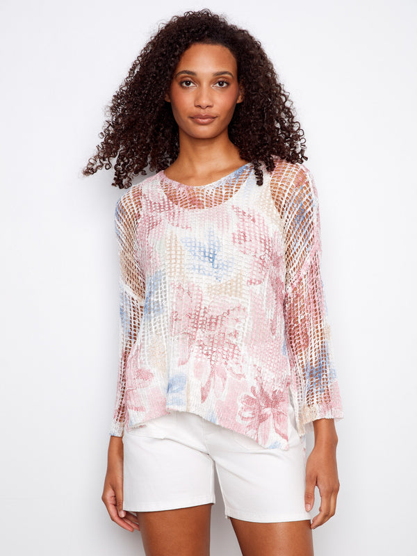 Adorned with a slit hem, this floral mesh top offers stylish movement and flair to your everyday ensemble by Charlie B.