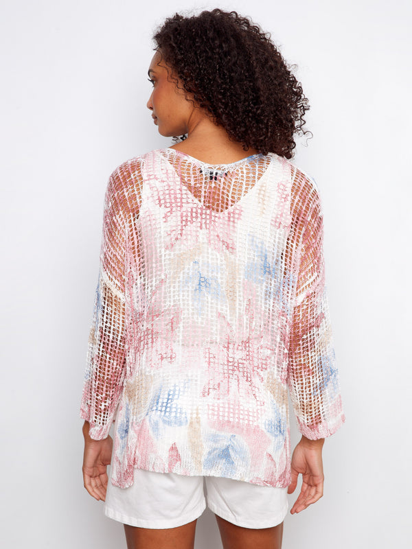 Featuring a flattering V-neck design, this mesh top enhances the neckline while maintaining comfort and style by Charlie B.