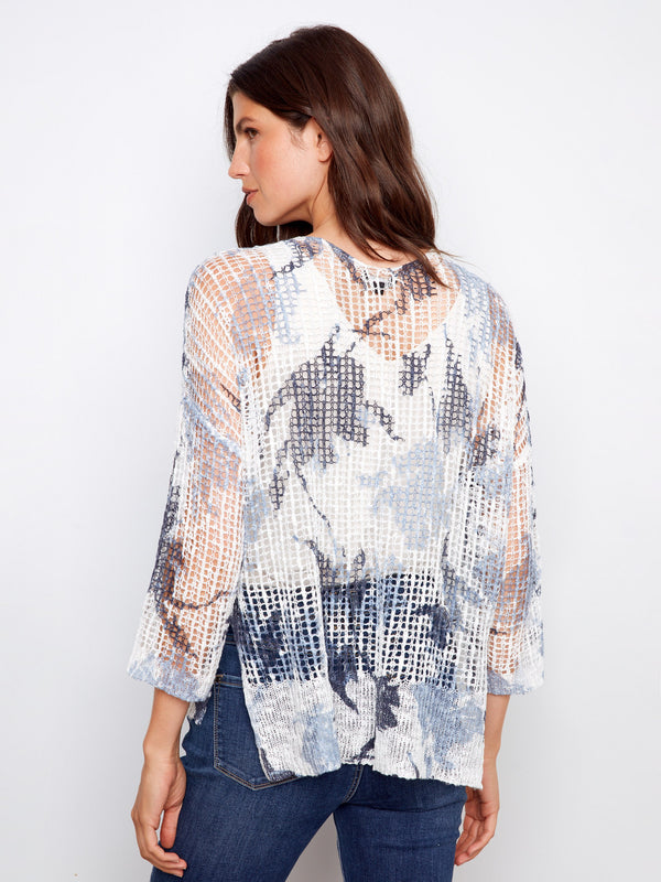 Abstract print fishnet crochet sweater with a loose fit and elegant 3/4 sleeves by Charlie B.