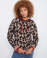 Elevate your look with contrast trims that beautifully frame the bold pattern on this cozy hoodie. By Charlie B.
