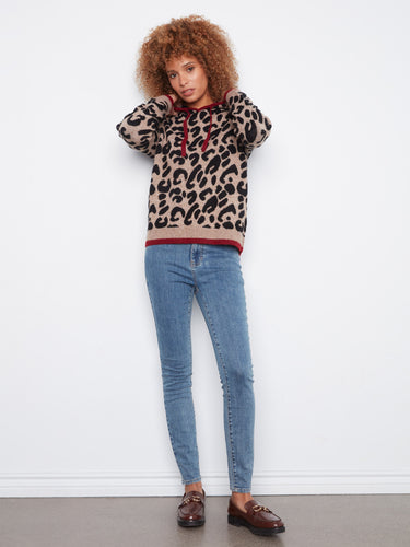 Stay stylish and warm with long sleeves featuring ribbed cuffs for a snug fit in this chic knit design. By Charlie B.