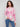 Cozy pink abstract print hoodie sweater with knit cuffs, offering both style and comfort by Charlie B.