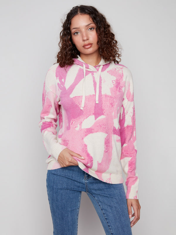 Cozy pink abstract print hoodie sweater with knit cuffs, offering both style and comfort by Charlie B.