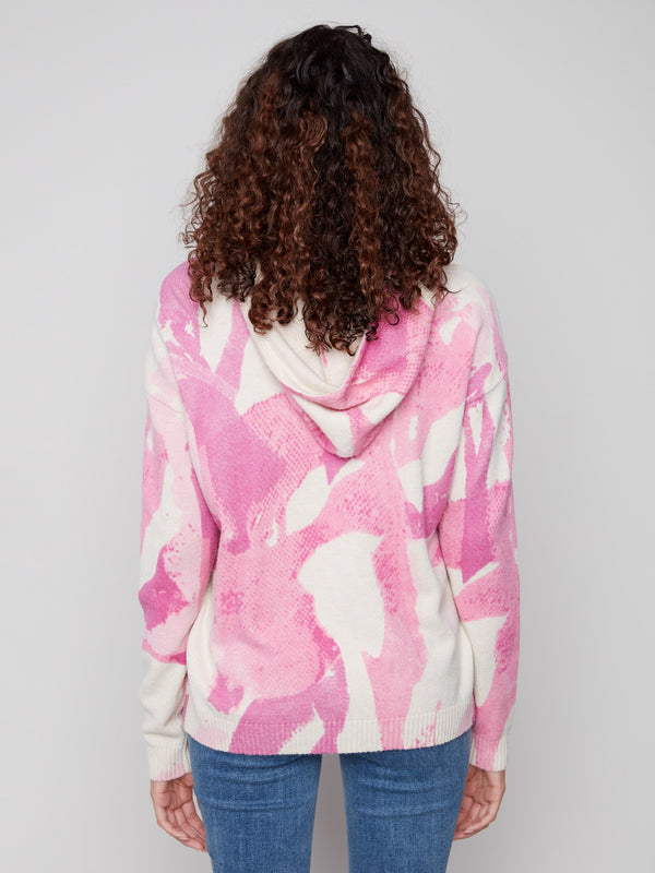 Elegant pink abstract printed hoodie showcasing the attached hood, adding flair to your wardrobe by Charlie B.
