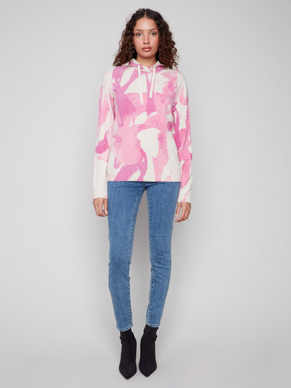 Trendy pink abstract print sweater with long sleeves and drop shoulders, combining fashion and ease by Charlie B.
