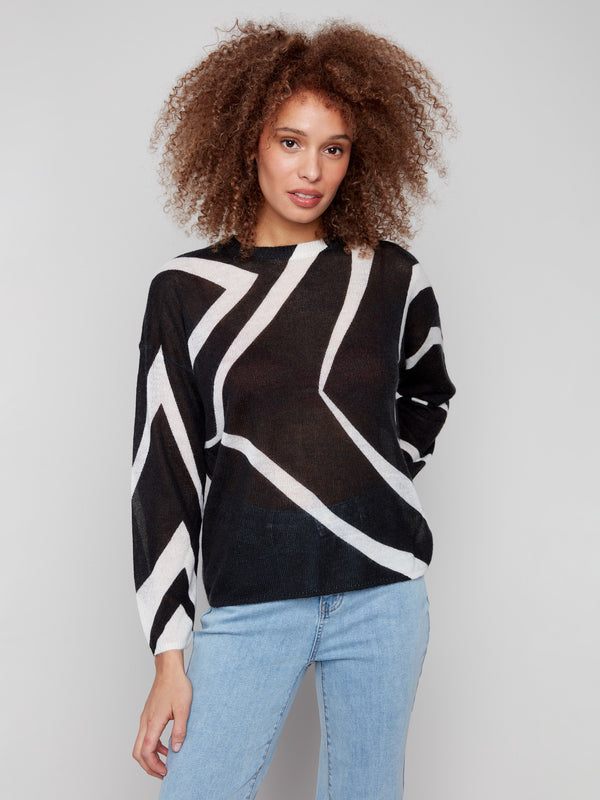 Semi-sheer knit sweater with a bold geometric pattern in Black/Ecru, perfect for layering in style by Charlie B.