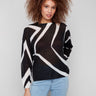 Semi-sheer knit sweater with a bold geometric pattern in Black/Ecru, perfect for layering in style by Charlie B.