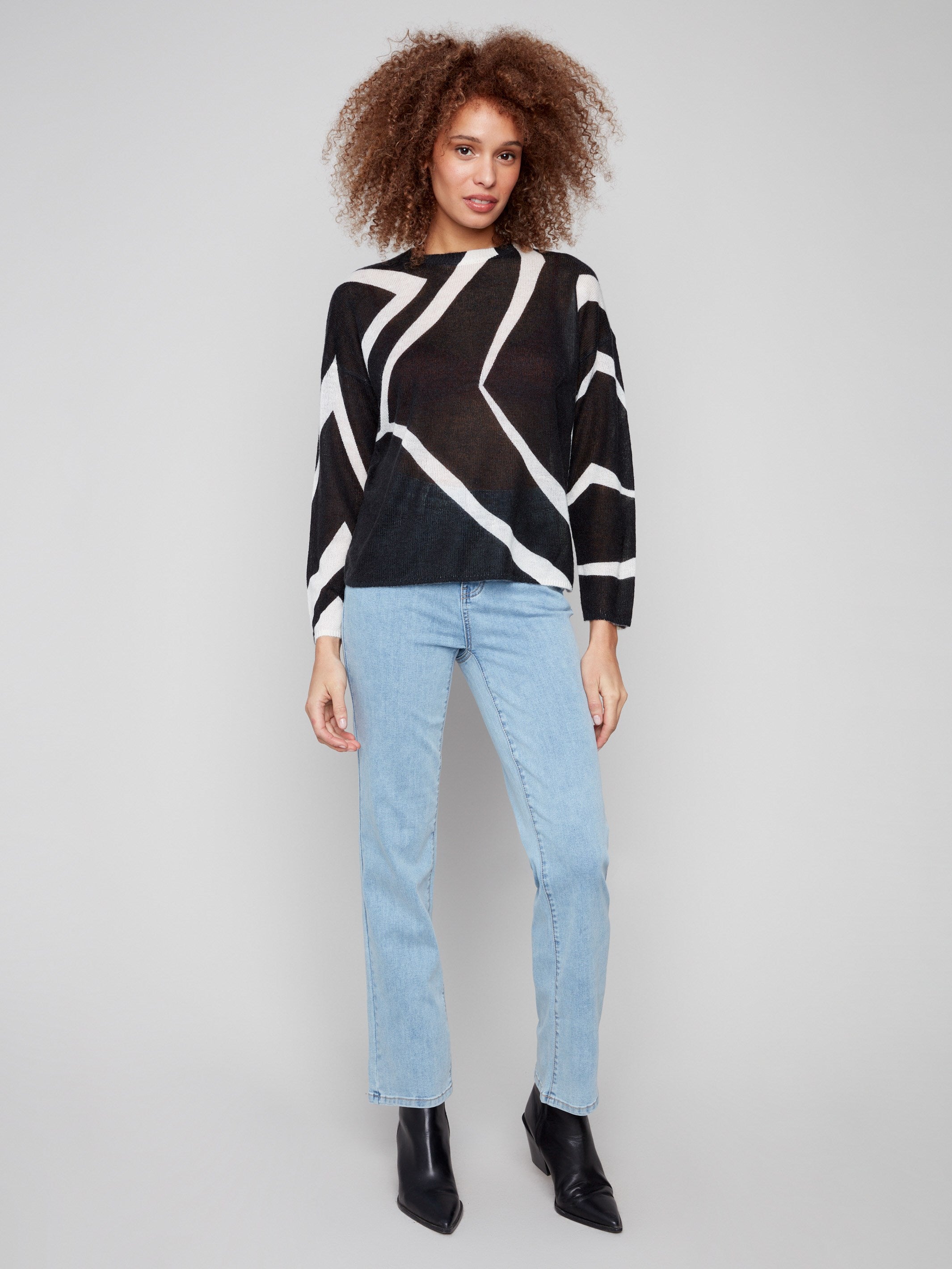 Drop shoulder design enhances the relaxed fit of this mohair-like sweater with striking patterns by Charlie B.