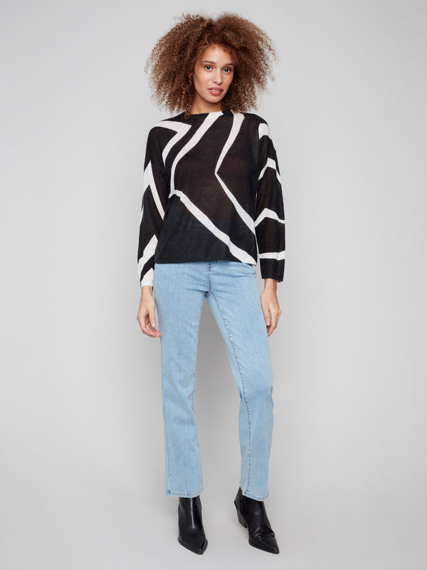 Drop shoulder design enhances the relaxed fit of this mohair-like sweater with striking patterns by Charlie B.