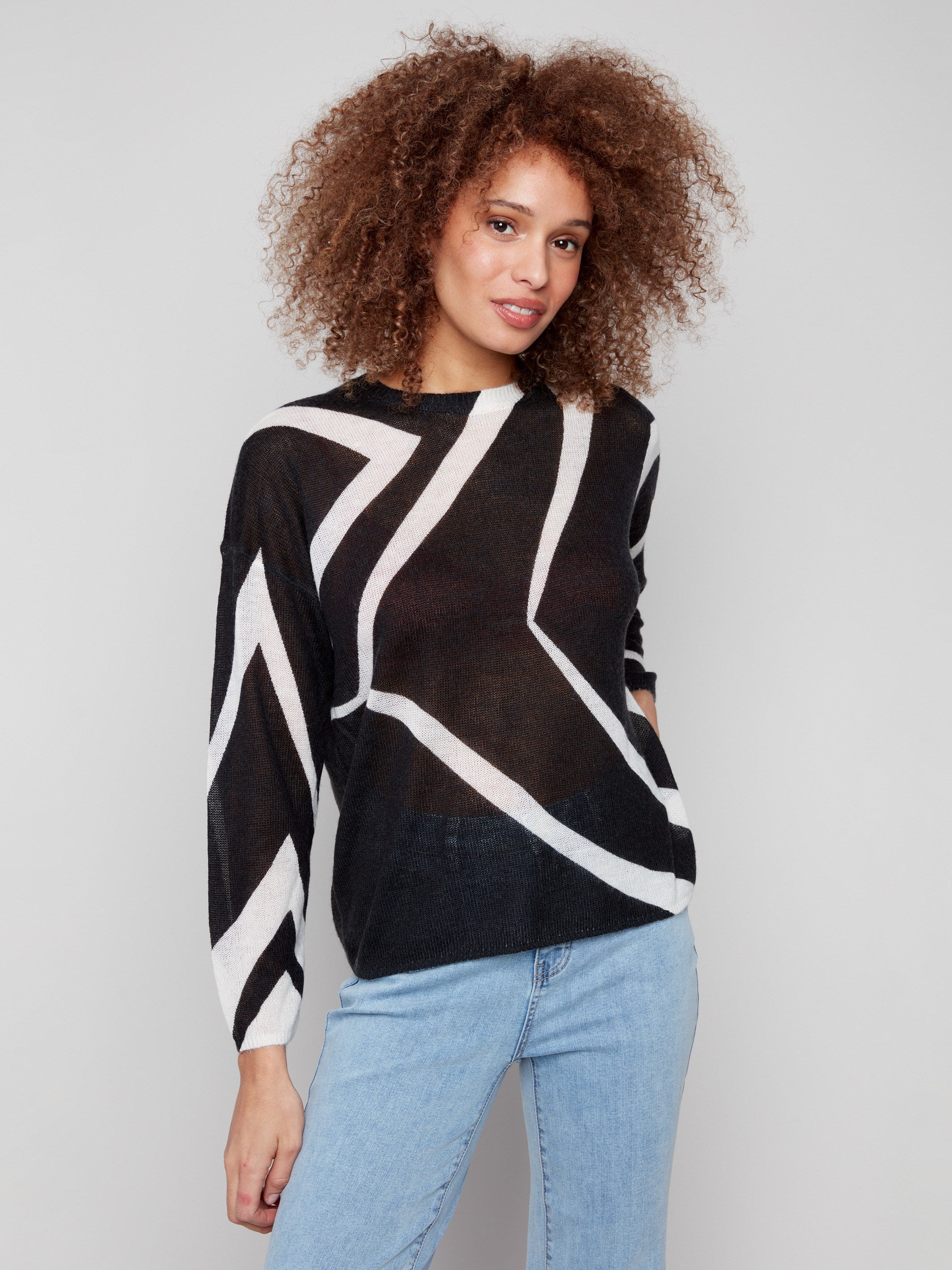 Crew neckline complements the eye-catching Black/Ecru pattern on this lightweight knit sweater by Charlie B.