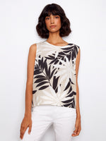 Tropical print top with a crew neckline, perfect for casual outings. Pair it with your favorite bottoms for a chic look by Charlie B.